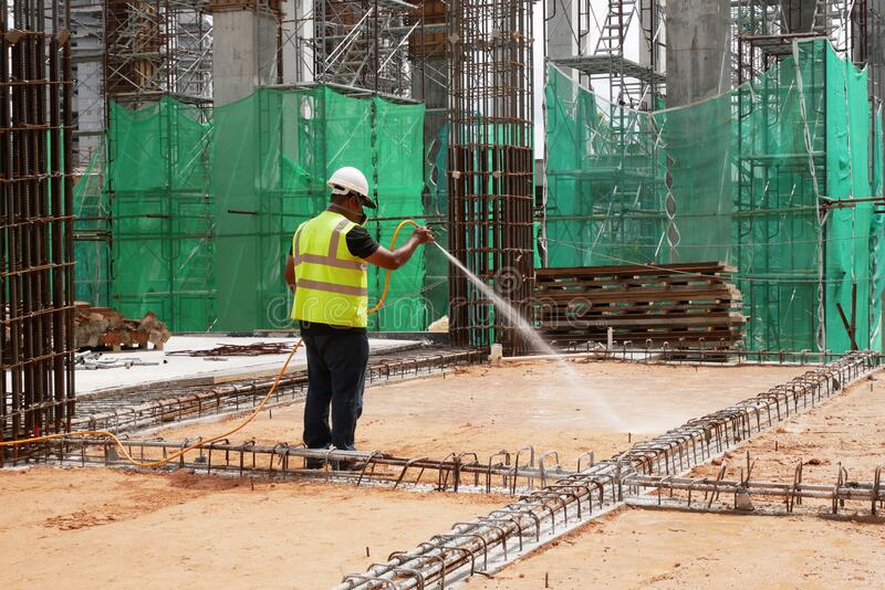 construction-workers-mixing-spraying-anti-termite-chemical-treatment-to-soil-kuala-lumpur-malaysia-july-site-218104075