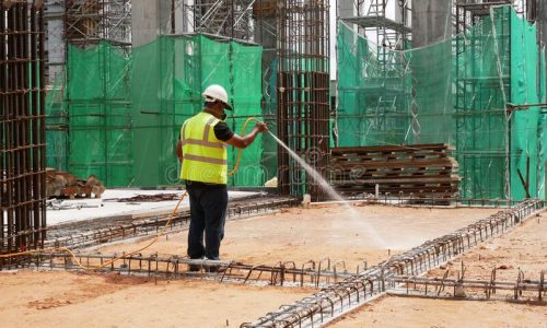 construction-workers-mixing-spraying-anti-termite-chemical-treatment-to-soil-kuala-lumpur-malaysia-july-site-218104075